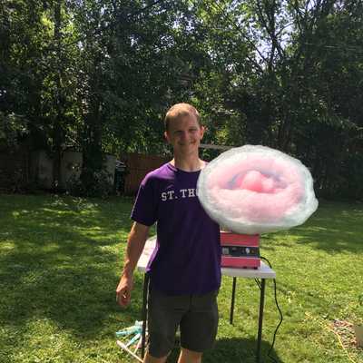 Joe holds a giant cone of cotton candy